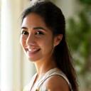 Portrait of Sophia Lee, a friendly wellness practitioner offering personalized coaching.